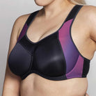 Black and purple sports bra on a plain background