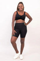Blue Sky Clipper Top in Black shown on a model against a white background, worn with black shorts. 