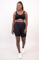 Blue Sky Clipper Top in Black shown on a model against a white background, worn with black shorts. 