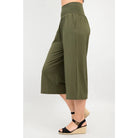 Blue Sky Gaylene Capri in Khaki shown on a model against a white background, from the side view. 