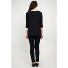 Blue Sky Jazz 3/4 Sleeve Top in Black shown on a model wearing black leggings standing against a white background, from the back view. 
