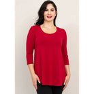 Blue Sky Jazz 3/4 Sleeve Top in Lipstick Red shown on a model wearing black leggings against a white background, from the front view. 