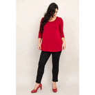 Blue Sky Jazz 3/4 Sleeve Top in Lipstick Red shown on a model wearing black leggings against a white background, from the front view. 