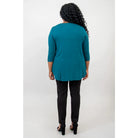 Blue Sky Jazz 3/4 Sleeve Top in Teal shown on a model wearing black leggings against a white background, from the back view. 