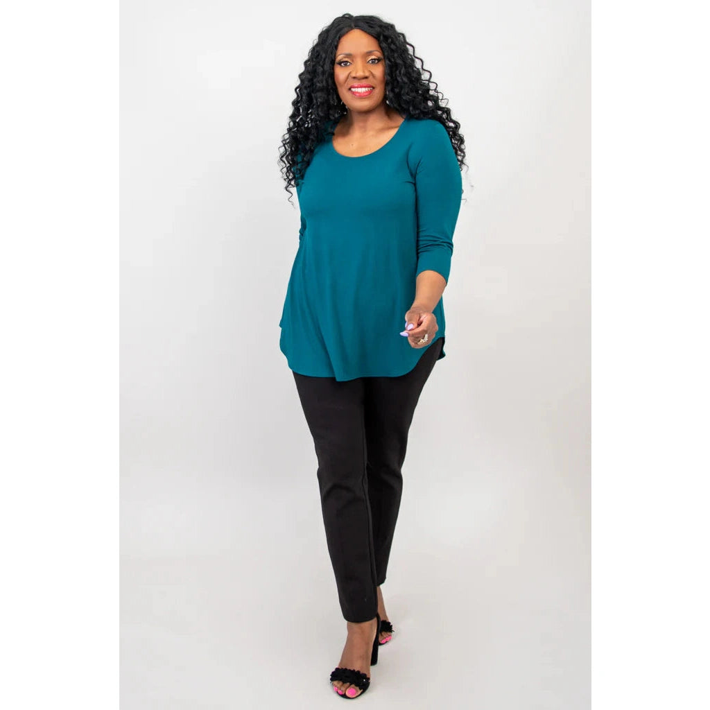 Blue Sky Jazz 3/4 Sleeve Top in Teal shown on a model wearing black leggings against a white background, from the front view. 