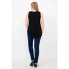 Blue Sky Jazz Tank in Black shown on a model wearing blue leggings standing against a white background, from the back view. 