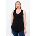 Blue Sky Jazz Tank in Black shown on a model wearing blue leggings standing against a white background, from the front view. 