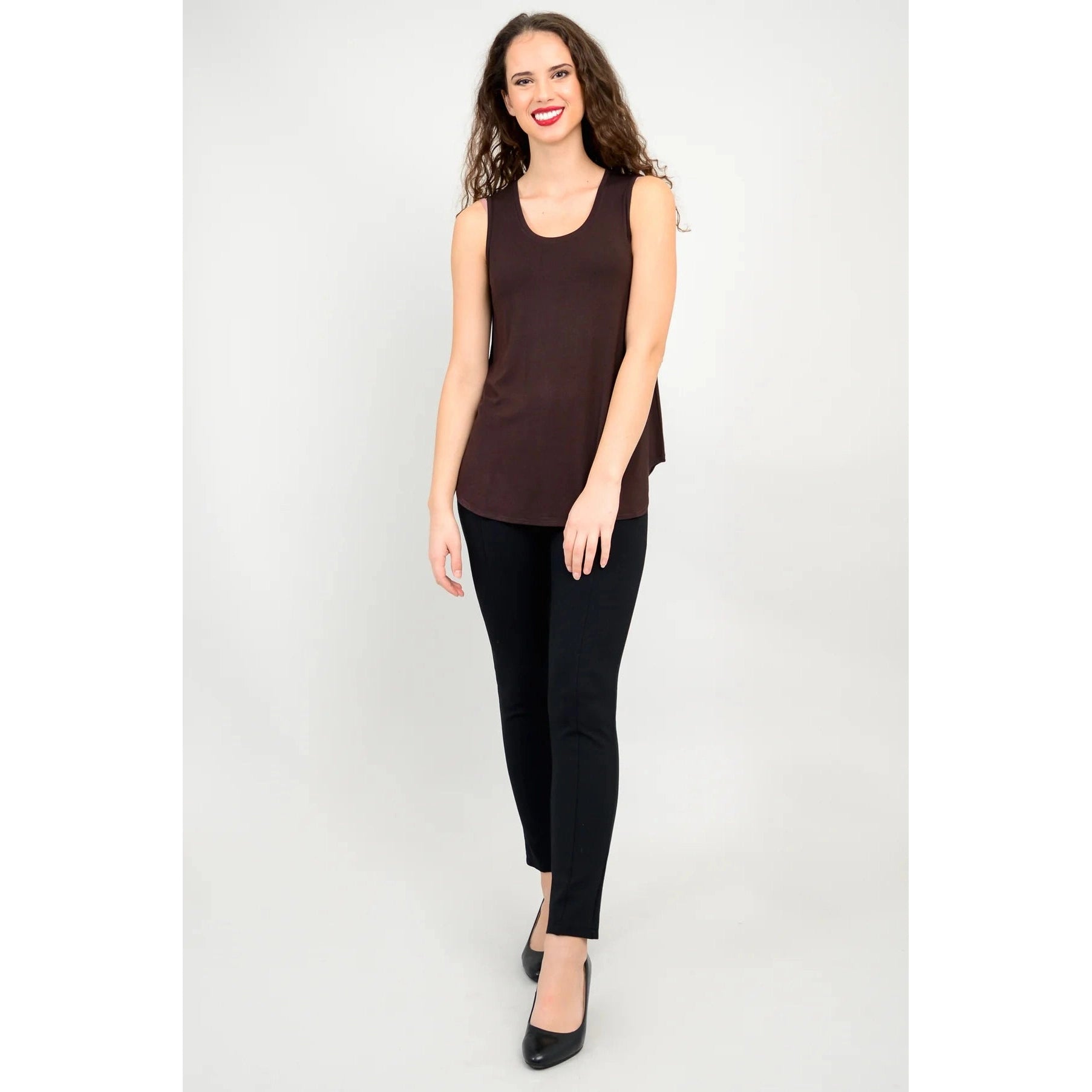 Blue Sky Jazz Tank in Coffee shown on a model wearing black leggings, against a white background, from the front view. 