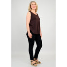 Blue Sky Jazz Tank in Coffee shown on a model wearing black leggings, against a white background, from the front view. 