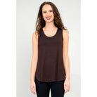 Blue Sky Jazz Tank in Coffee shown on a model wearing black leggings, against a white background, from the front view. 