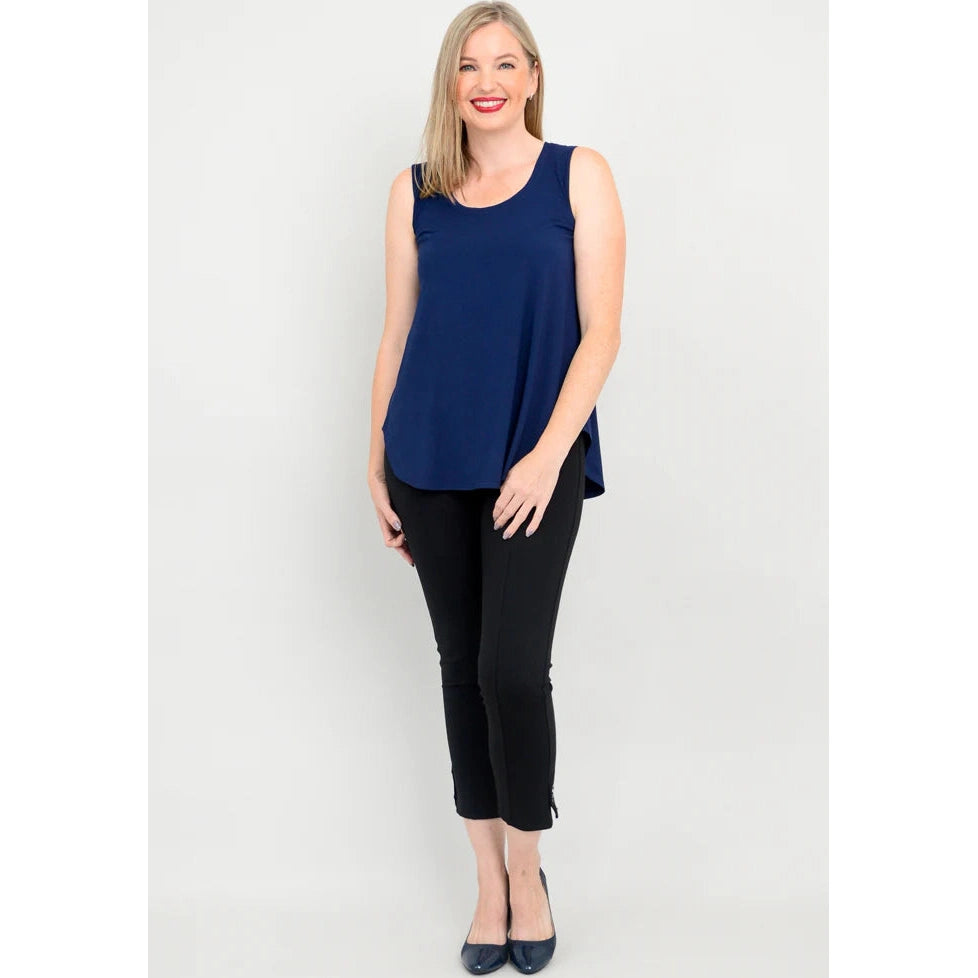 Blue Sky Jazz Tank in Indigo shown on a model wearing black leggings standing against a white background, from the front view. 