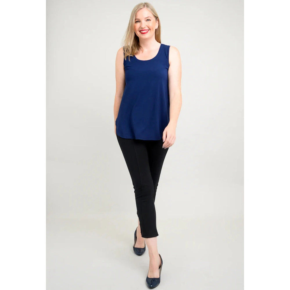 Blue Sky Jazz Tank in Indigo shown on a model wearing black leggings standing against a white background, from the front view. 
