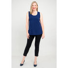 Blue Sky Jazz Tank in Indigo shown on a model wearing black leggings standing against a white background, from the front view. 