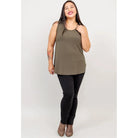 Blue Sky Jazz Tank in Khaki Green shown on a model wearing black leggings against a white background, from the front view. 