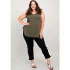 Blue Sky Jazz Tank in Khaki Green shown on a model wearing black leggings against a white background, from the front view. 