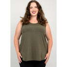 Blue Sky Jazz Tank in Khaki Green shown on a model wearing black leggings against a white background, from the front view. 