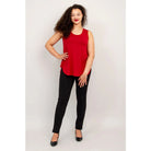 Blue Sky Jazz Tank in Lipstick Red shown on a model wearing black leggings against a white background, from the front view. 