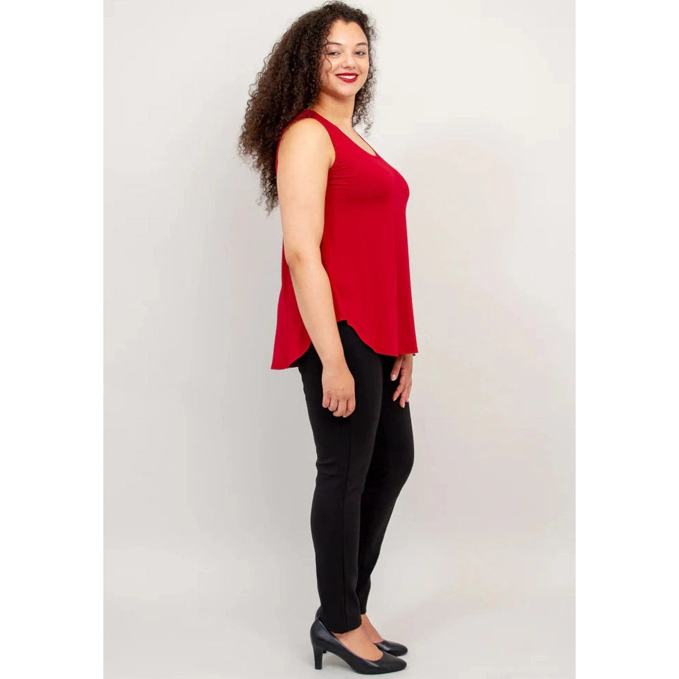 Blue Sky Jazz Tank in Lipstick Red shown on a model wearing black leggings against a white background, from the side view. 