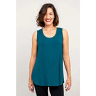 Blue Sky Jazz Tank in Teal shown on a model wearing black leggings against a white background, from the front view. 