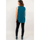 Blue Sky Jazz Tank in Teal shown on a model wearing black leggings against a white background, from the back view. 