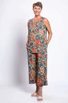 Blue Sky Jazz Tank in Vintage Khaki print shown on a model wearing matching capris, against a white background, shown from the front view.