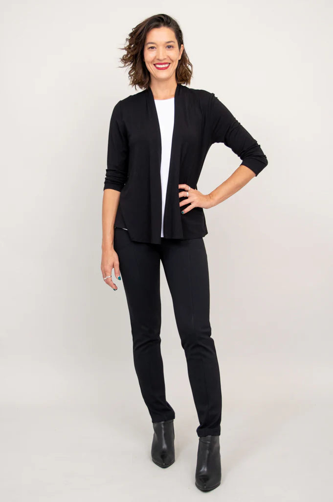 Blue Sky Kathy Jacket in Black shown on a model wearing it over a white tank with black pants against a white background, shown from the front. 