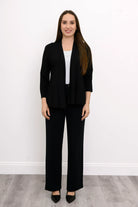 Blue Sky Kathy Jacket in Black shown on a model wearing it over a white tank with black pants against a white background, shown from the front. 