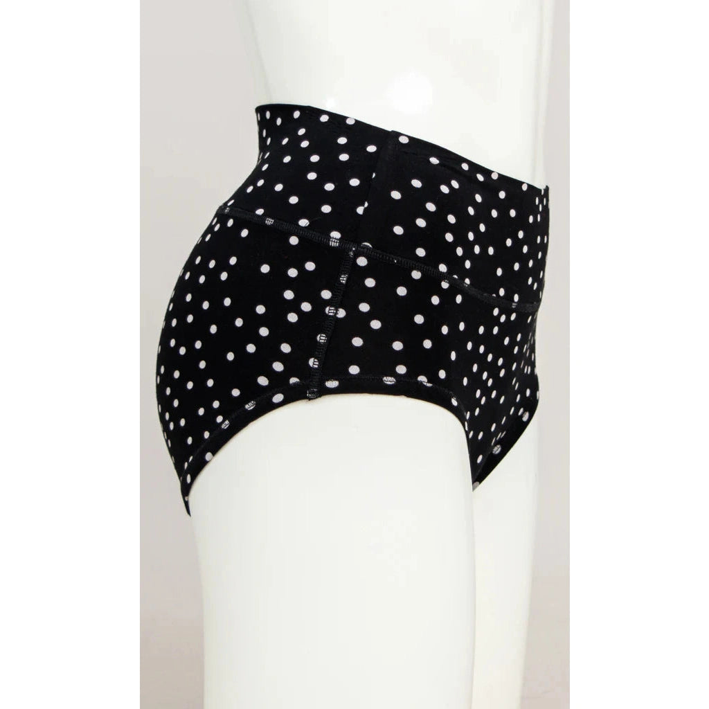 Blue Sky La Gaunche Full Brief in Polka, black panty with white dots pattern, shown on a mannequin against a white background, from the side view. 