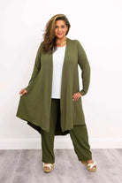 Blue Sky Priscilla Jacket in Khaki shown on a model wearing a white tank and khaki pants, standing against a white background, from the front view. 