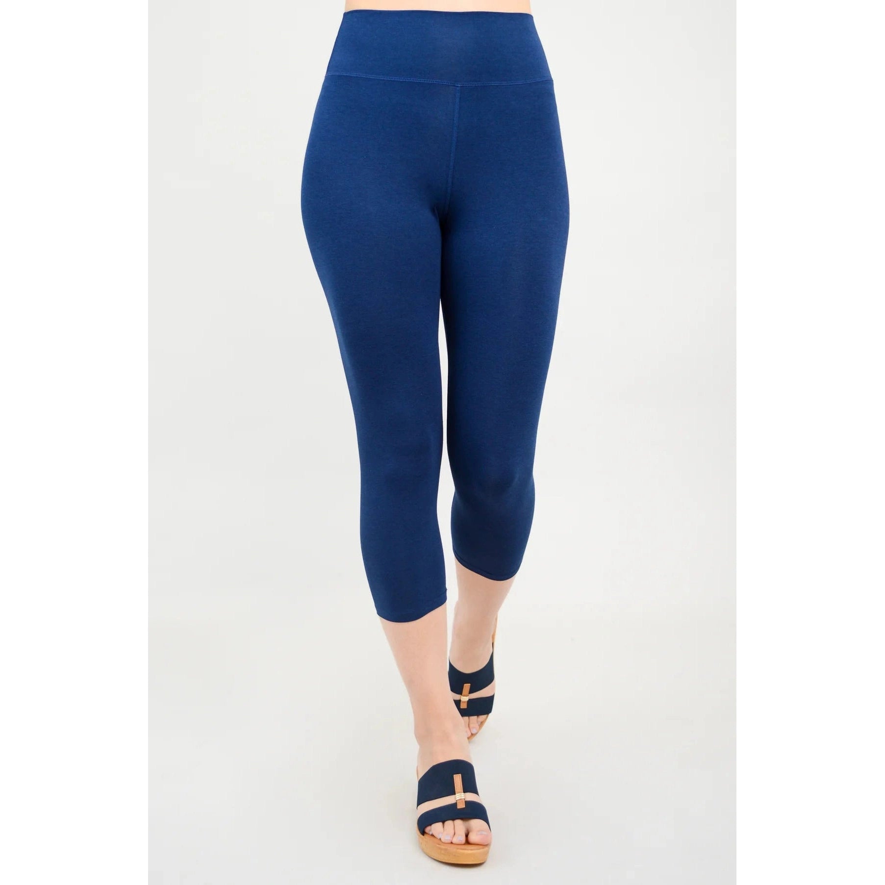 Blue Sky Riley Capris in Indigo shown on a model against a white background, from the front view. 