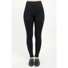 Blue Sky Riley Leggings in Black shown on a model against a white background, from the front view. 