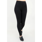 Blue Sky Riley Leggings in Black shown on a model against a white background, from the front view. 