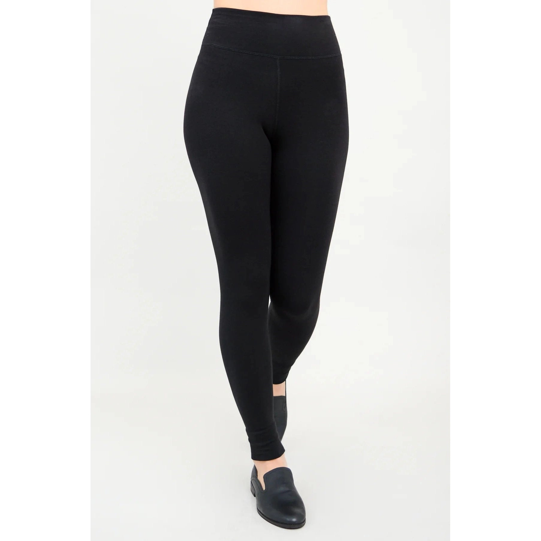 Blue Sky Riley Leggings in Black shown on a model against a white background, from the front view. 
