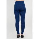 Blue Sky Riley Leggings in Indigo shown on a model against a white background, from the back view. 