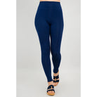 Blue Sky Riley Leggings in Indigo shown on a model against a white background, from the front view. 