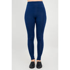 Blue Sky Riley Leggings in Indigo shown on a model against a white background, from the front view. 