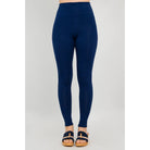 Blue Sky Riley Leggings in Indigo shown on a model against a white background, from the front view. 