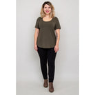 Blue Sky Tessa Tee in Khaki shown on a model wearing black leggings against a white background, from the front view. 