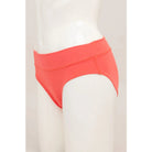 Blue Sky The Hipster Panty in Coral orange shown on a mannequin against a white background, from the side view. 