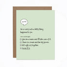 A greeting card with a humorous message printed on it, accompanied by a brown envelope. The card is placed on a white background.