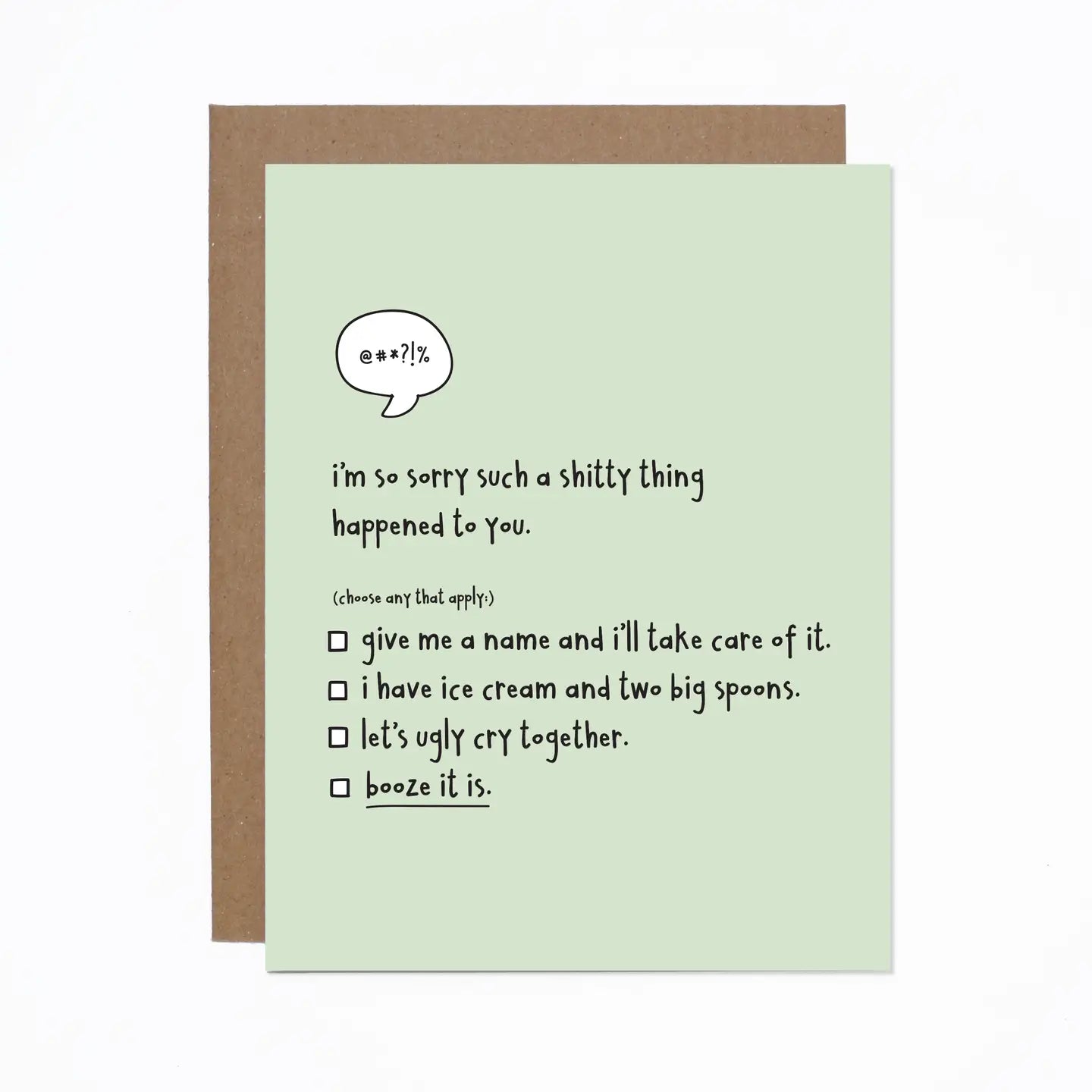 A greeting card with a humorous message printed on it, accompanied by a brown envelope. The card is placed on a white background.