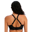 Woman wearing the Elomi Energise Sports Bra in black with a view of the back, straps racer-backed. 