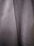 Close-up of navy Breezy pant fabric. 
