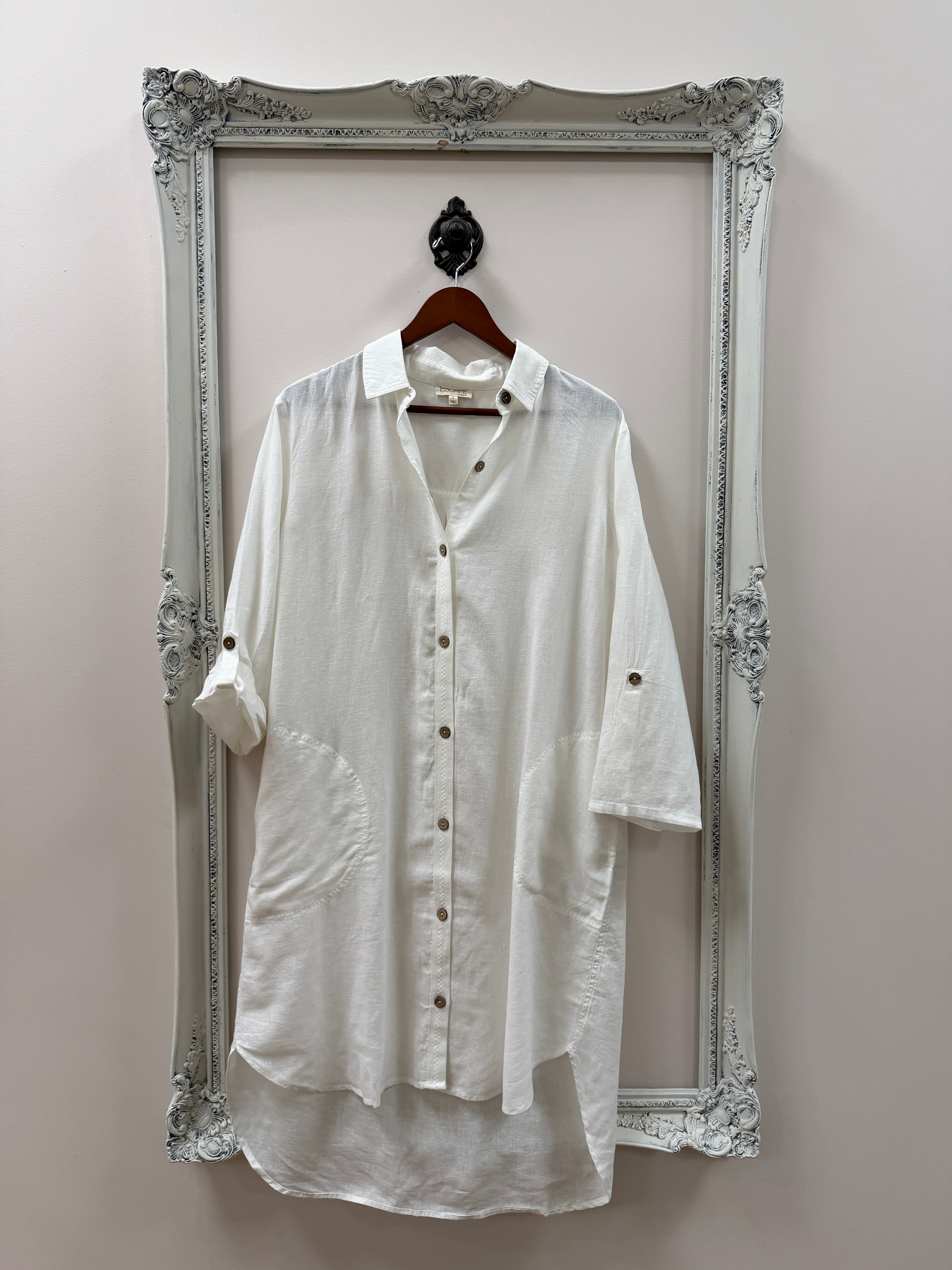 White dress shirt with black buttons on a white background