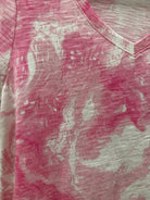 Close-up of pink fabric with a subtle pattern