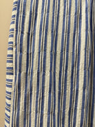 Striped fabric with blue and beige horizontal lines on a beige background