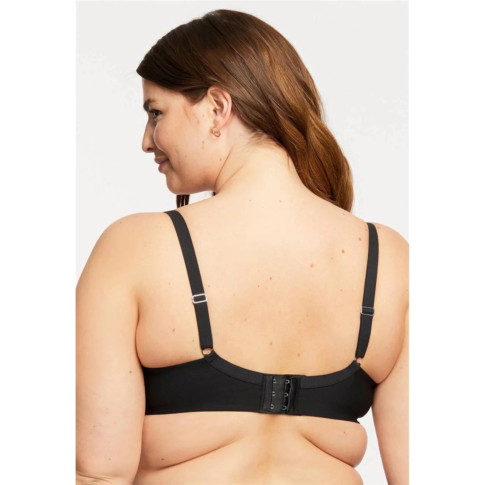 Montelle Sublime Spacer Bra in black shown on a model against a white background, from the back view. 