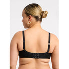 Montelle Sublime Spacer Bra in black shown on a model against a white background, from the back view. 