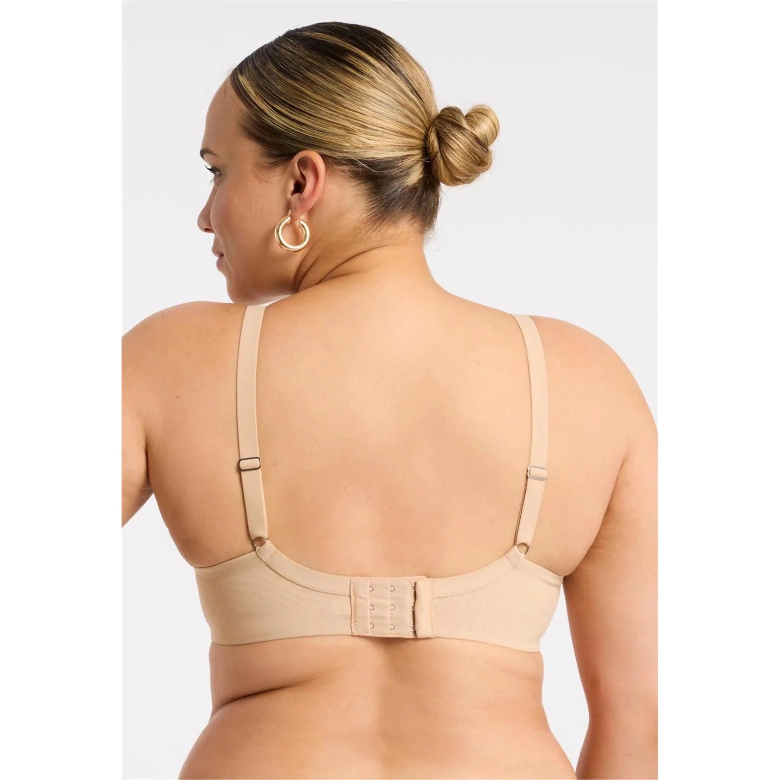Montelle Sublime Spacer bra in Sand shown on a model against a white background from the back view. 