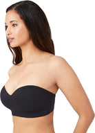 Woman wearing a black Wacoal Red Carpet strapless bra on a white background showing the side angle view. 